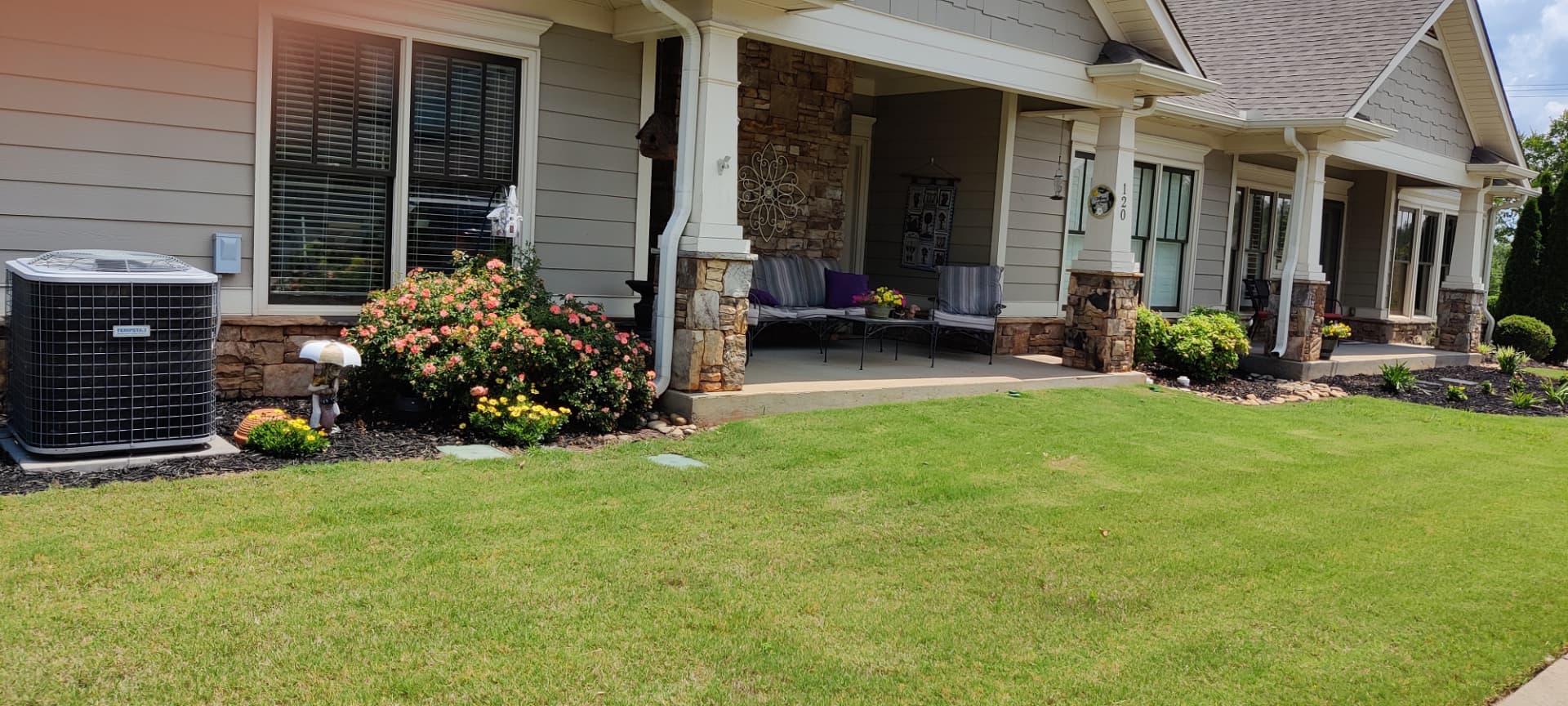 Front porch of a completed senior living residence with outdoor seating